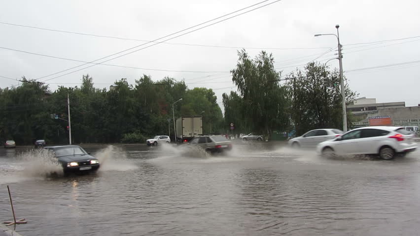 flooding\xA0in town streets\xA0after torrential rain