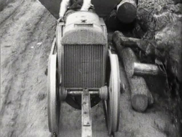 1920s - Tractors are demonstrated in the snow and a shipment heads for England by train in 1921.