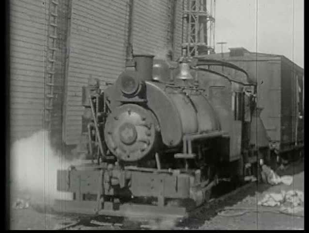1920s - Blocks of ice are prepared and loaded onto trains in 1920.