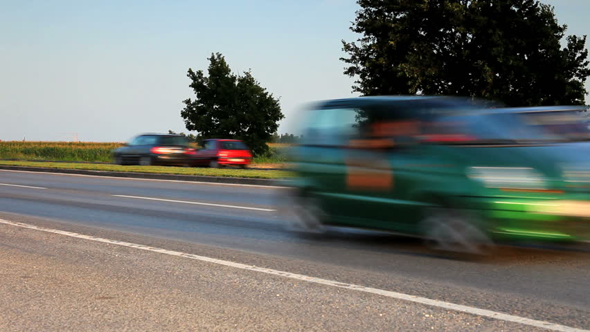 Car driving in the sunset