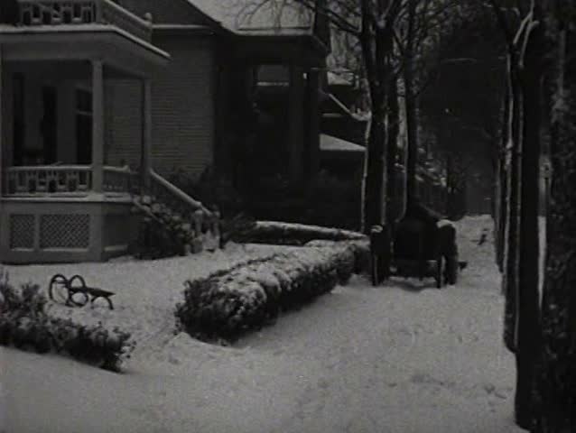1920s - Tractors are demonstrated in the snow and a shipment heads for England by train in 1921.