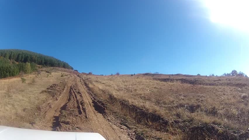 Point of View, day country side, dirt road driving. pov 