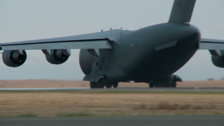A military C17 Globemaster takes off and climbs out
