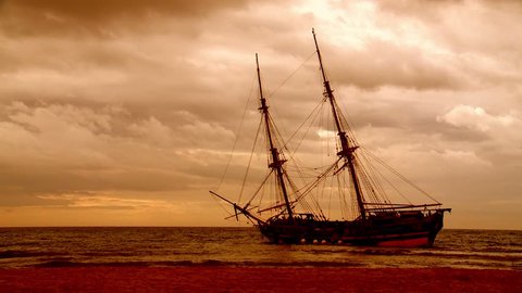 traditional square rigger  aground after a storm.