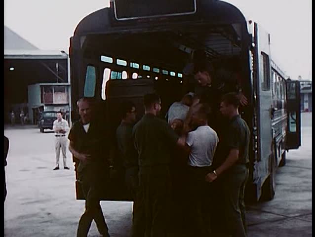 1960s - Wounded and injured soldiers are transported onto a cargo plane during the Vietnam War.