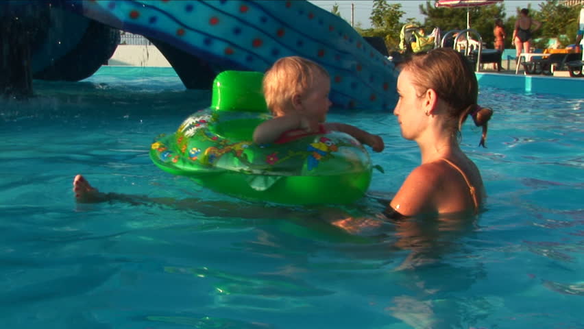 Mother and child in water park