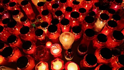 Thousands of colorful bright candles illuminating a cemetery during  All Saint's Day