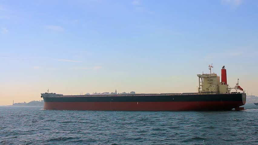 Tanker ship on route to open sea. Side view of the crude oil tanker. High