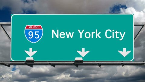 New York City Interstate 95 overhead freeway sign with time lapse clouds.