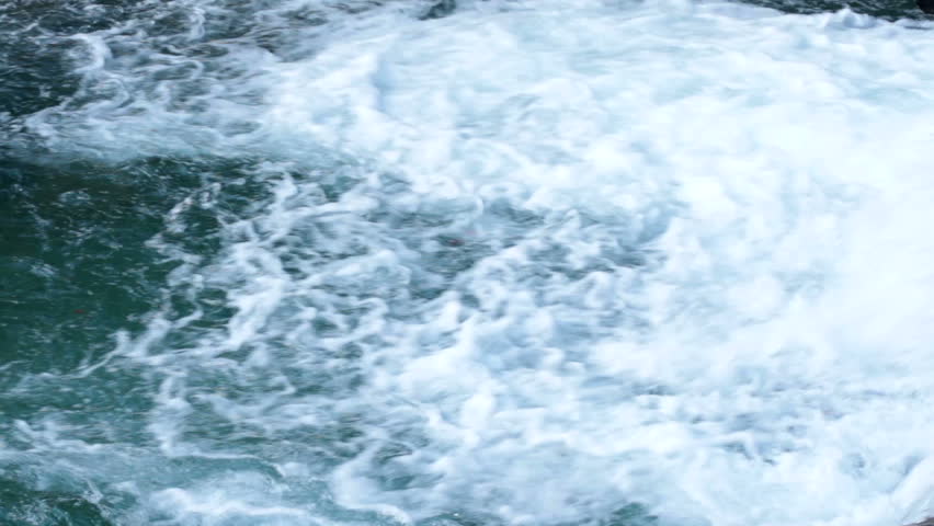 Close up on water at the bottom of a small waterfall. High definition video. | Shutterstock HD Video #5004599