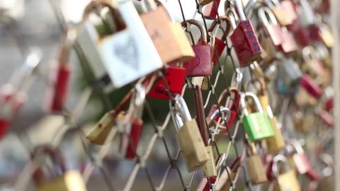 Love locks on a fence on bridge above Salsa river