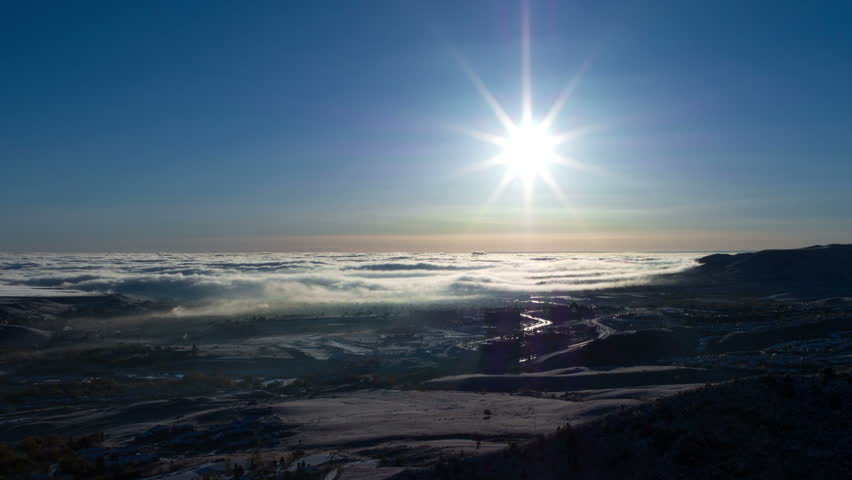 Wide Angle blanket of fog over the Denver area, with beautiful sun. HD 1080p