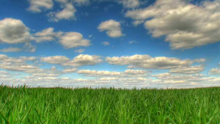 Blue sky over fields, HD time lapse clip, high dynamic range imaging