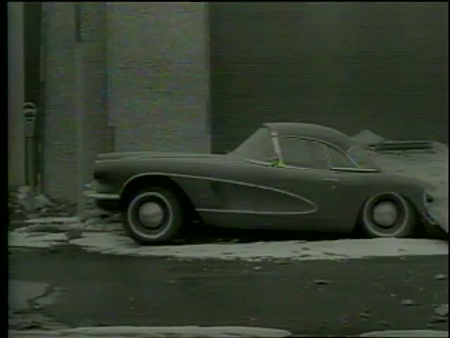 Office block with a section from the middle collapsed onto a car on the road during the earthquake, Anchorage, Alaska circa  1964-MGM PICTURES, UNIVERSAL-INTERNATIONAL NEWSREEL, USA, filmed in 1964