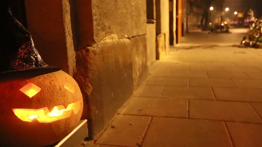 Jack-o-lantern, Halloween pumpkin in the street at night (HD)
