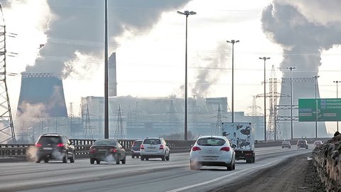City ringway with air pollution from heat electric generation plant in Saint-Petersburg, Russia. Strong vapor and smoke due extreme cold 