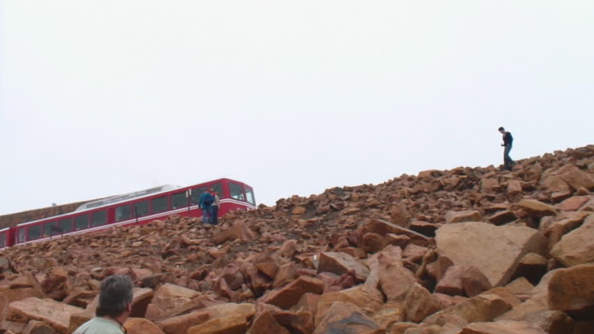 Pikes Peak and Manitou Cog Railway arrives at the summit of "America
