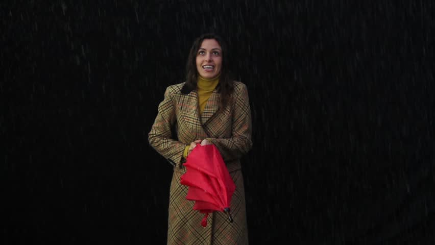 Woman Standing alone in the rain 