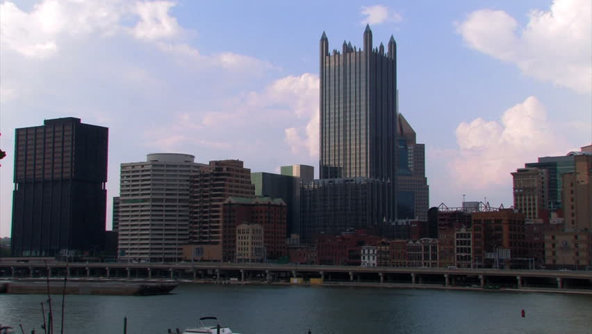 A coal barge passes downtown Pittsburgh, PA.
