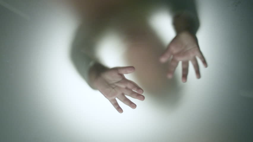 Hands knocks in blured glass | Shutterstock HD Video #5030327