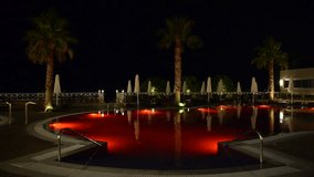 Swimming pool at the luxury hotel with red color of water