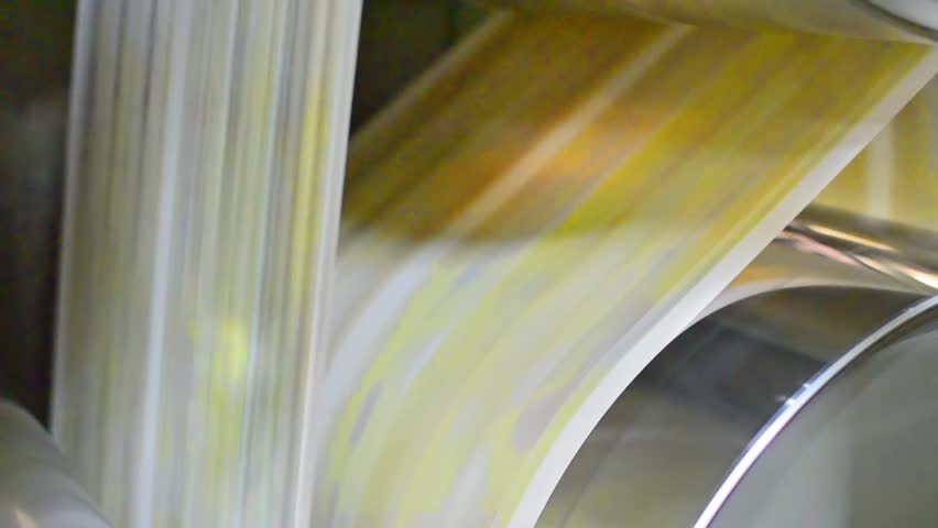 Newspaper printing - Stock Video. Newspaper coming fast of the printing machine