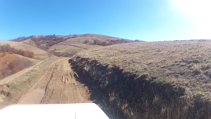 off-road driving - Stock Video. wide shot from a moving vehicle. Rally on a