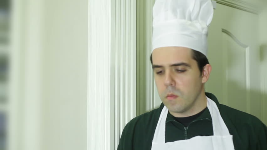 A chef taste testing food
