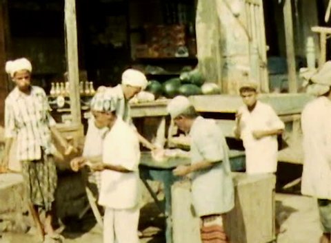 ADEN, CIRCA 1960: Aden Protectorate public food market vintage film SD. British Aden Protectorate in southern Arabia.  One of a kind private owned vintage and historic 8mm film. Republic of Yemen.
