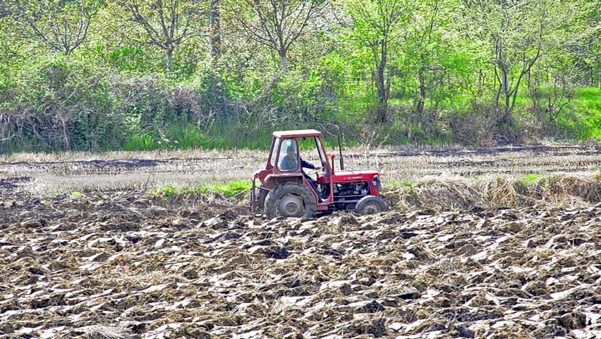 tractor is plotting agriculture field for seeding