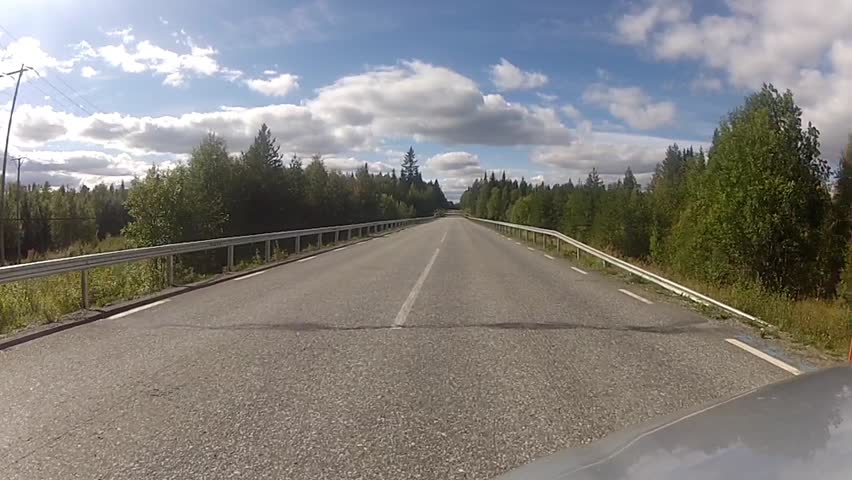 POV of driving down a quiet rural highway during the day in summer 1080 HD video
