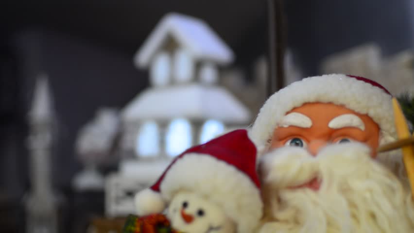 Santa Claus & Christmas house light - Stock Video. Focus changes from house to