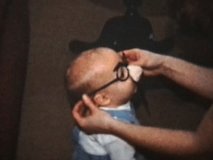 A Baby Wearing Funny Glasses (1964 - Vintage 8mm film)