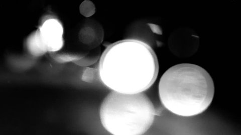 Circular white lights on black background in time-lapse video - white bokeh with movements effects - HDTV H.264 codec