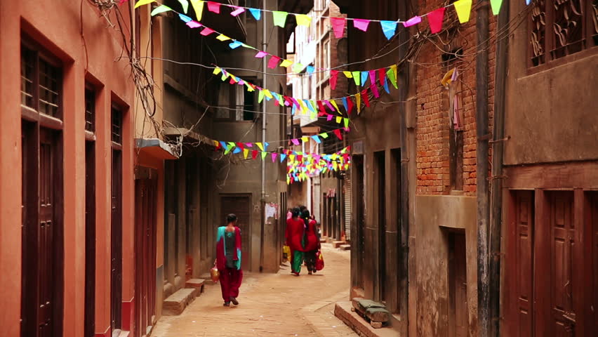 People walking along narrow lane near patan Durbar Square, Kathmandu, Nepal