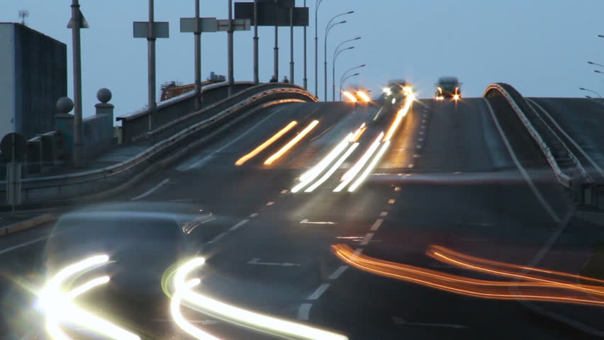 Car timelapse dusk, long light traces, driving city vehicles