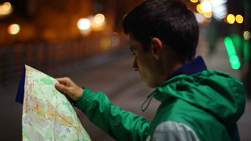 Lost tourist not citizen looking searching location map night