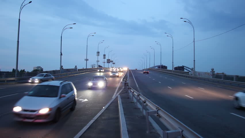 Dusk highway road city traffic, car drive lights on, sky