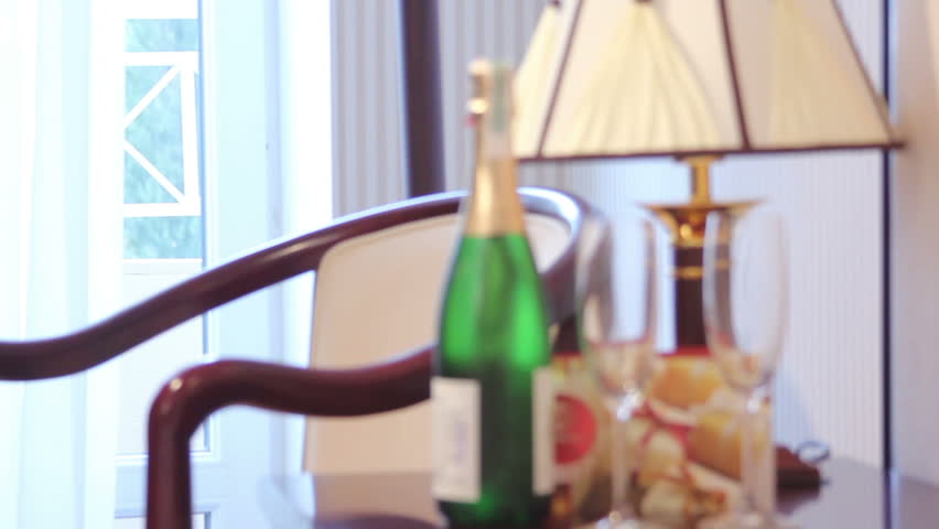 Champagne bottle with glasses in a luxury hotel room