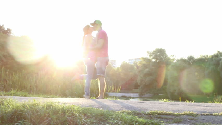 Boyfriend and girlfriend sexy passionate kisses at sunset pan | Shutterstock HD Video #5060183