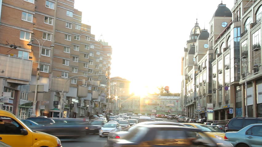 Timelapse cars move in city traffic jam, dusk sunlight shine