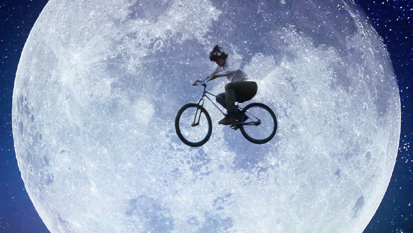 Bicycle moon flyer, male bike across night sky slow motion