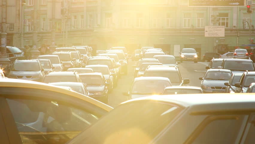 City traffic jam dusk sunlight cars stuck street, light movement