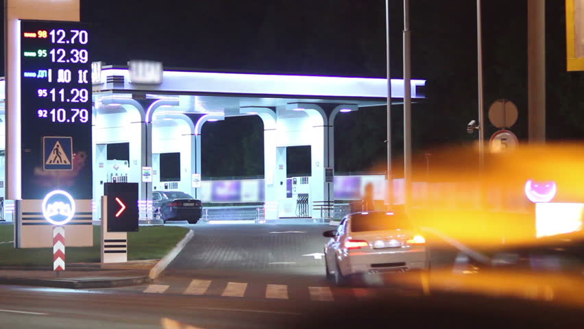 Gas station drive in, entrance car move inside, petrol prices