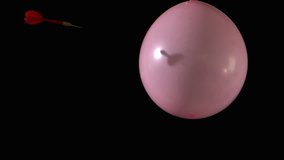 Dart piercing pink balloon in slow motion in slow motion - Powered by Shutterstock - Get 15% off with code: PIKWIZARD15