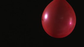 Dart piercing red balloon in slow motion in slow motion - Powered by Shutterstock - Get 15% off with code: PIKWIZARD15