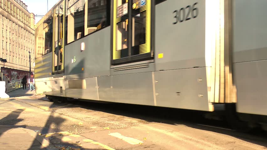 MANCHESTER CIRCA 2013: Tram drives through city centre - Manchester City Center,