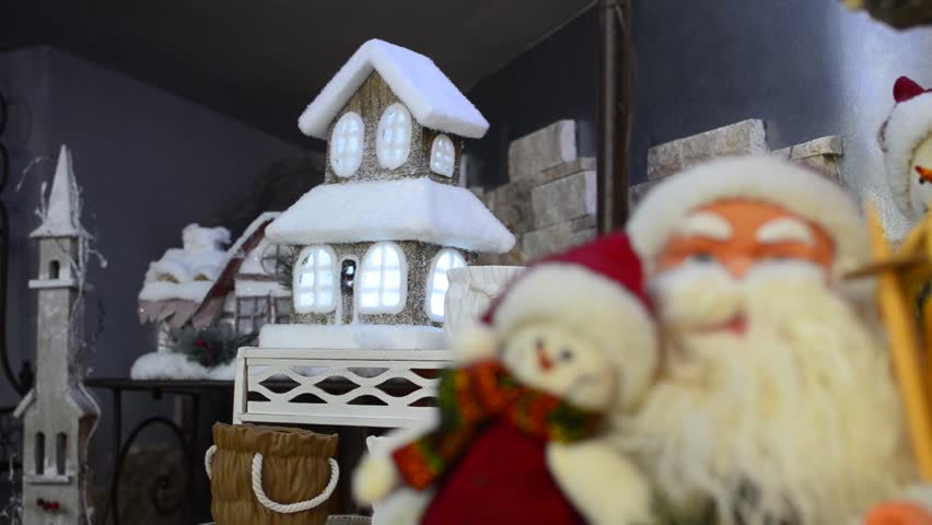 Santa Claus & Christmas house light - Stock Video. Focus changes from house to