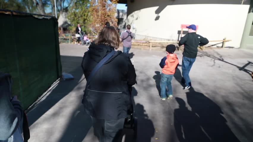 A family walking around the zoo