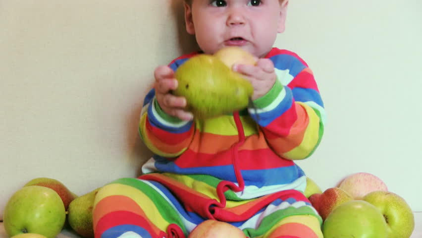 Adorable child with apples